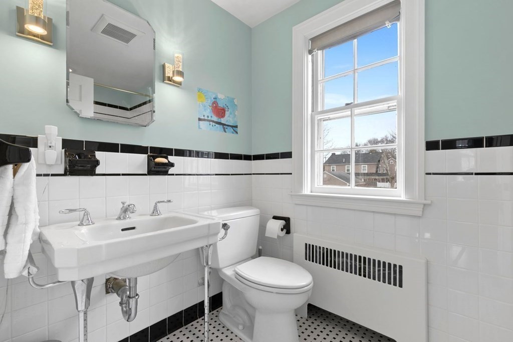 10 Standish Road Milton, MA 02186 - Photo 19 of 28 a bathroom with a sink toilet and a mirror