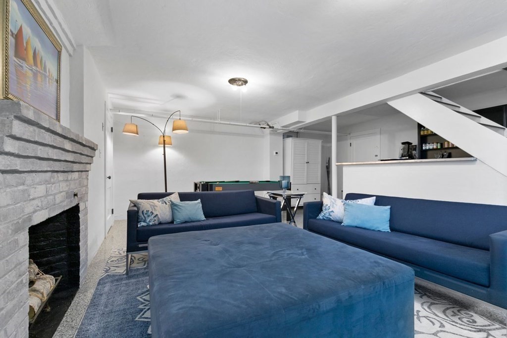 10 Standish Road Milton, MA 02186 - Photo 21 of 28 a living room with furniture and a fireplace