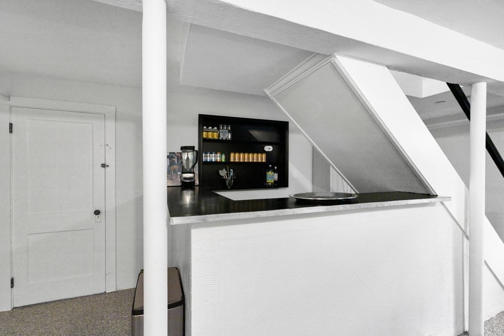 10 Standish Road Milton, MA 02186 - Photo 22 of 28 a view of a living room with wooden floor and staircase