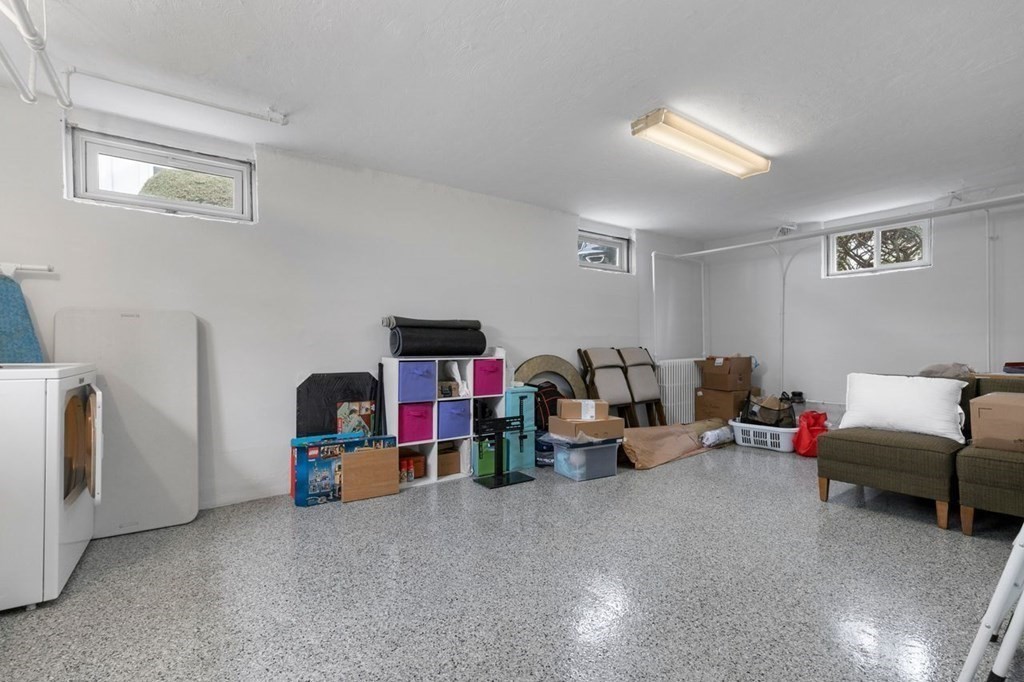 10 Standish Road Milton, MA 02186 - Photo 23 of 28 a living room with furniture and a flat screen tv