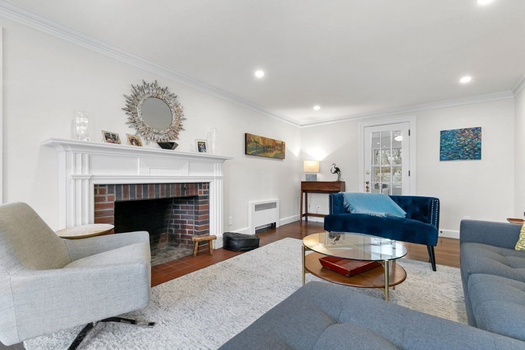 10 Standish Road Milton, MA 02186 - Photo 4 of 28 a living room with furniture and a fireplace