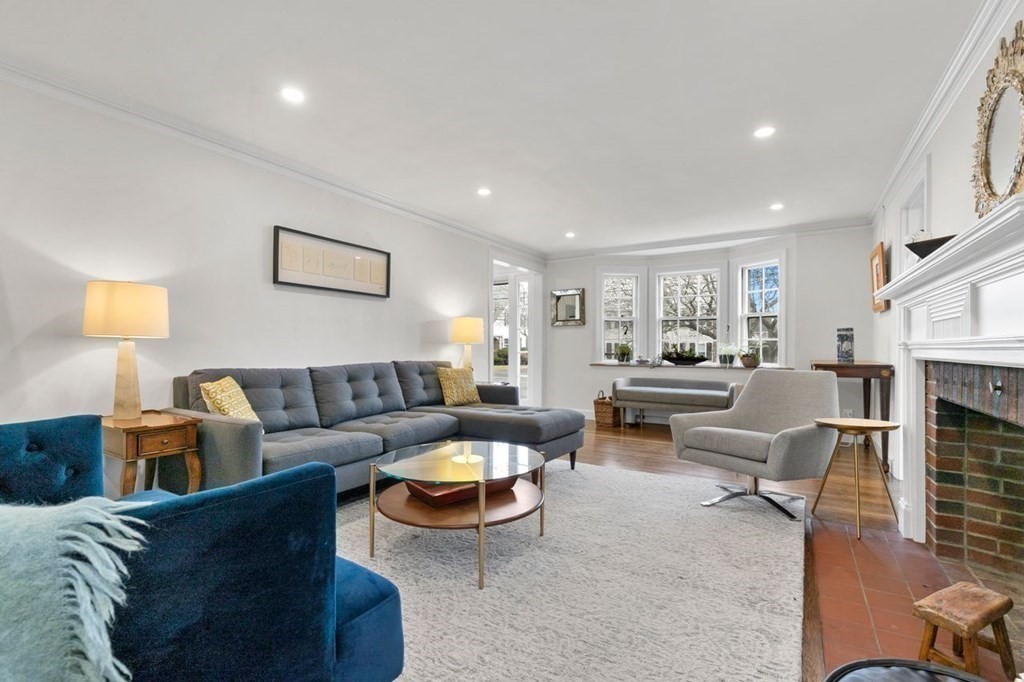 10 Standish Road Milton, MA 02186 - Photo 5 of 28 a living room with furniture and a fireplace