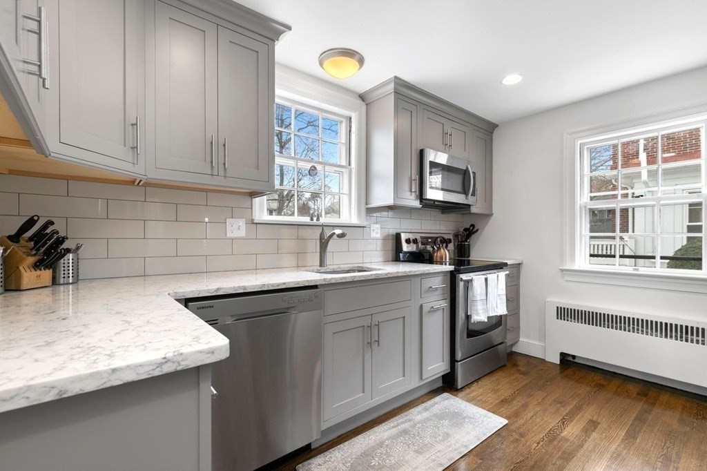 10 Standish Road Milton, MA 02186 - Photo 10 of 28 a kitchen that has a sink and a stove in it