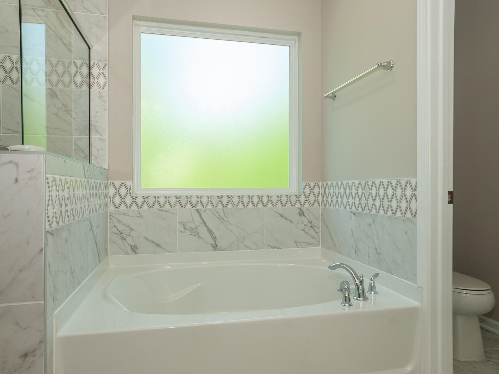 4001 Mountjoy Trail Raleigh, NC 27616 - Photo 32 of 59 a bathroom with a bathtub and shower