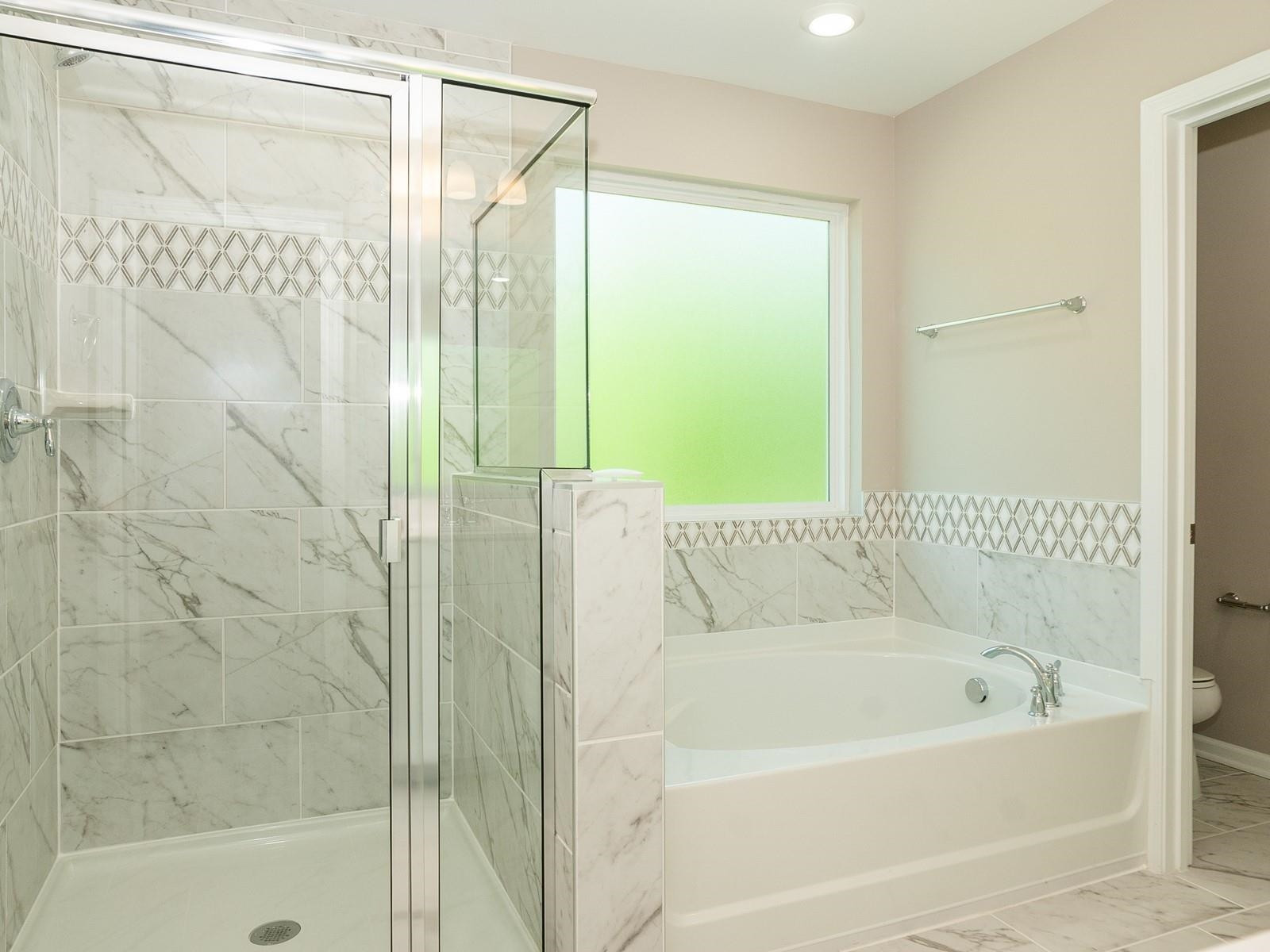 4001 Mountjoy Trail Raleigh, NC 27616 - Photo 34 of 59 a bathroom with a bathtub and a shower