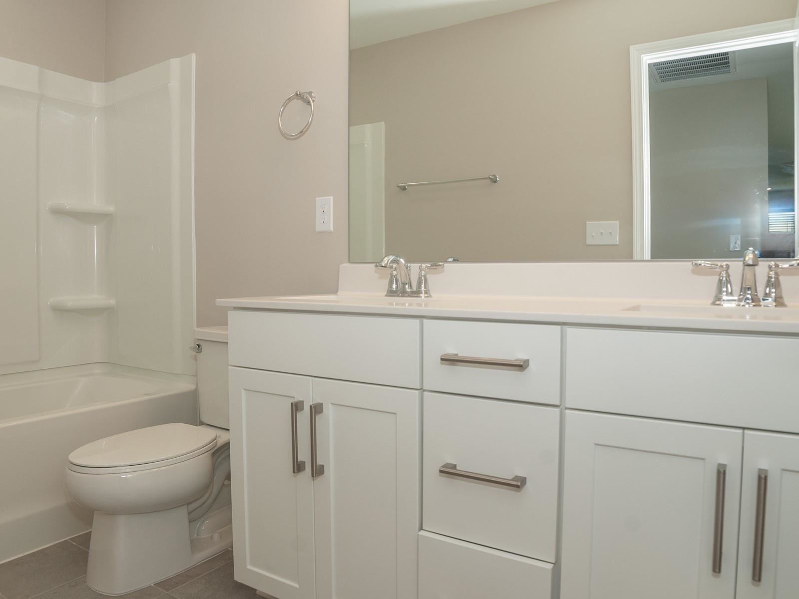 4001 Mountjoy Trail Raleigh, NC 27616 - Photo 41 of 59 a bathroom with a sink toilet vanity and shower