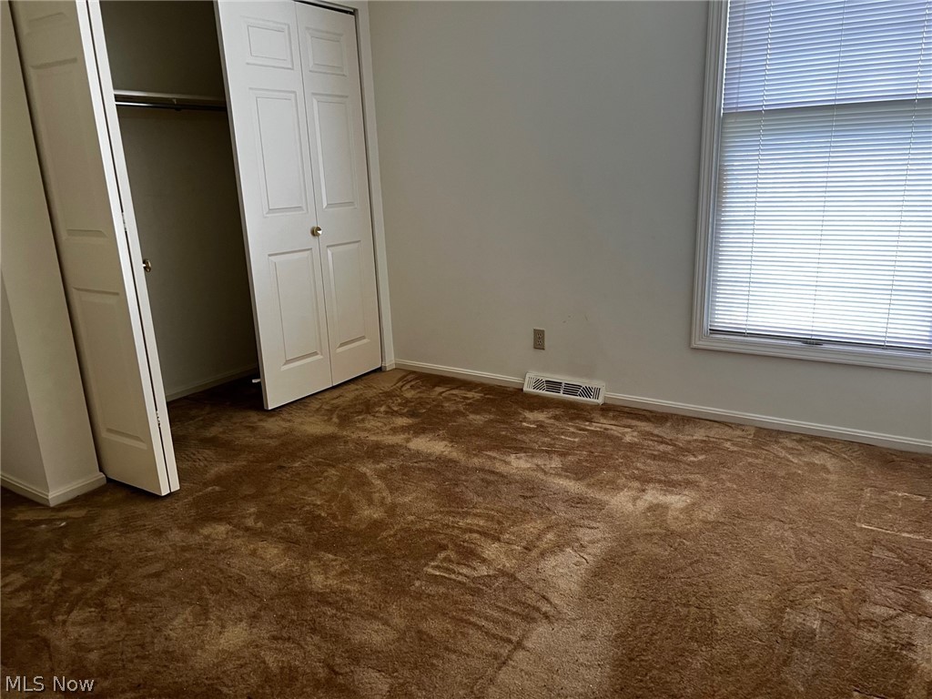 3415 Warren - Sharon Road Vienna, OH 44473 - Photo 9 of 16 Unfurnished bedroom with dark carpet