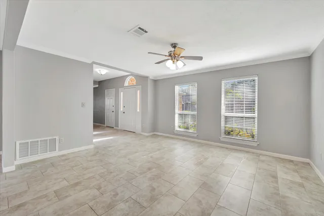 a view of an empty room with a window
