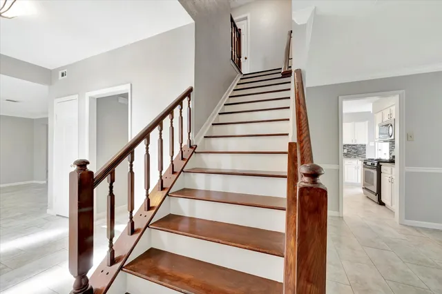 a view of an entryway with wooden floor