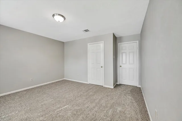 a living room with furniture a rug and a window