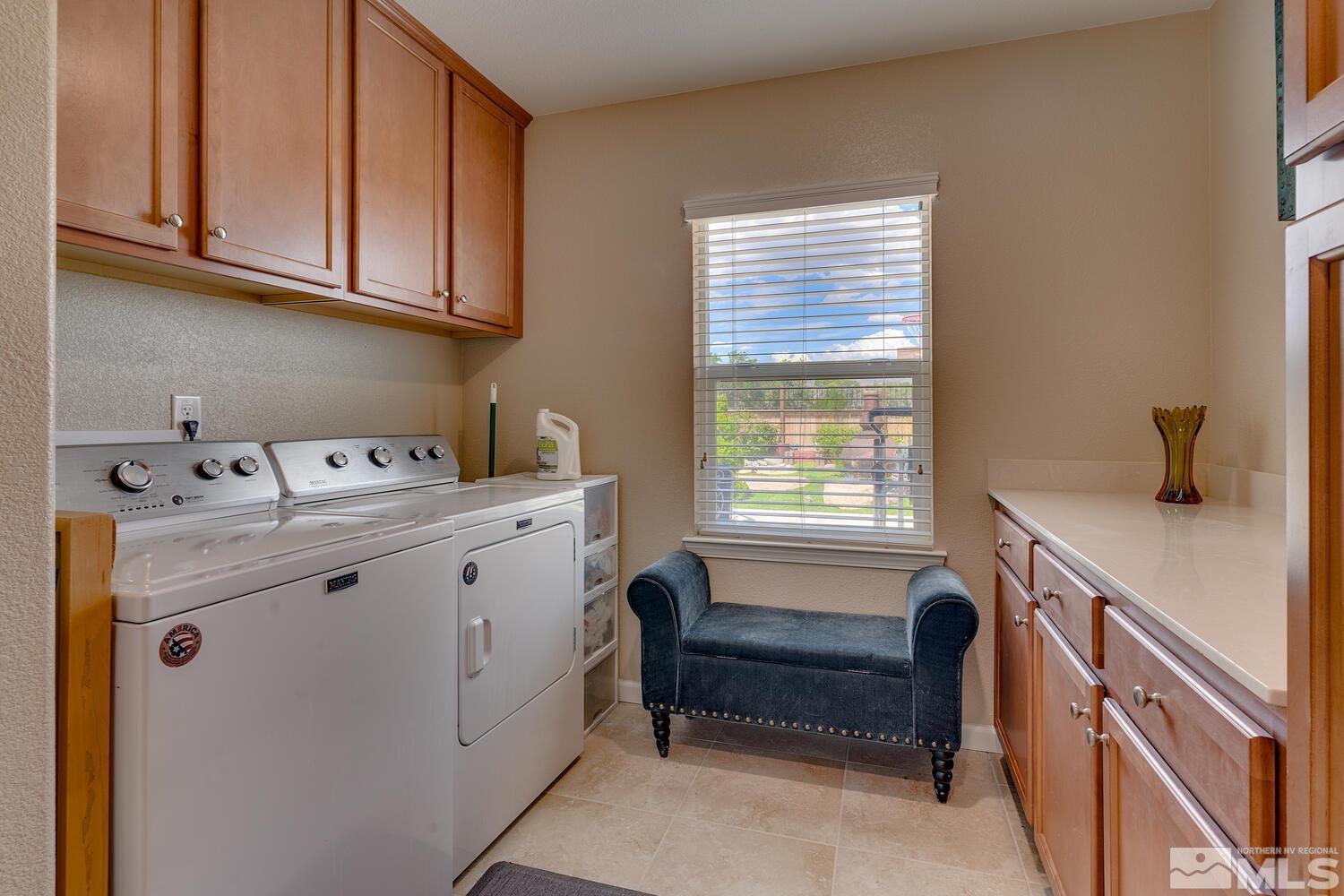 148 Carson River Drive Dayton, NV 89403 - Photo 11 of 31 a utility room with cabinets washer and dryer