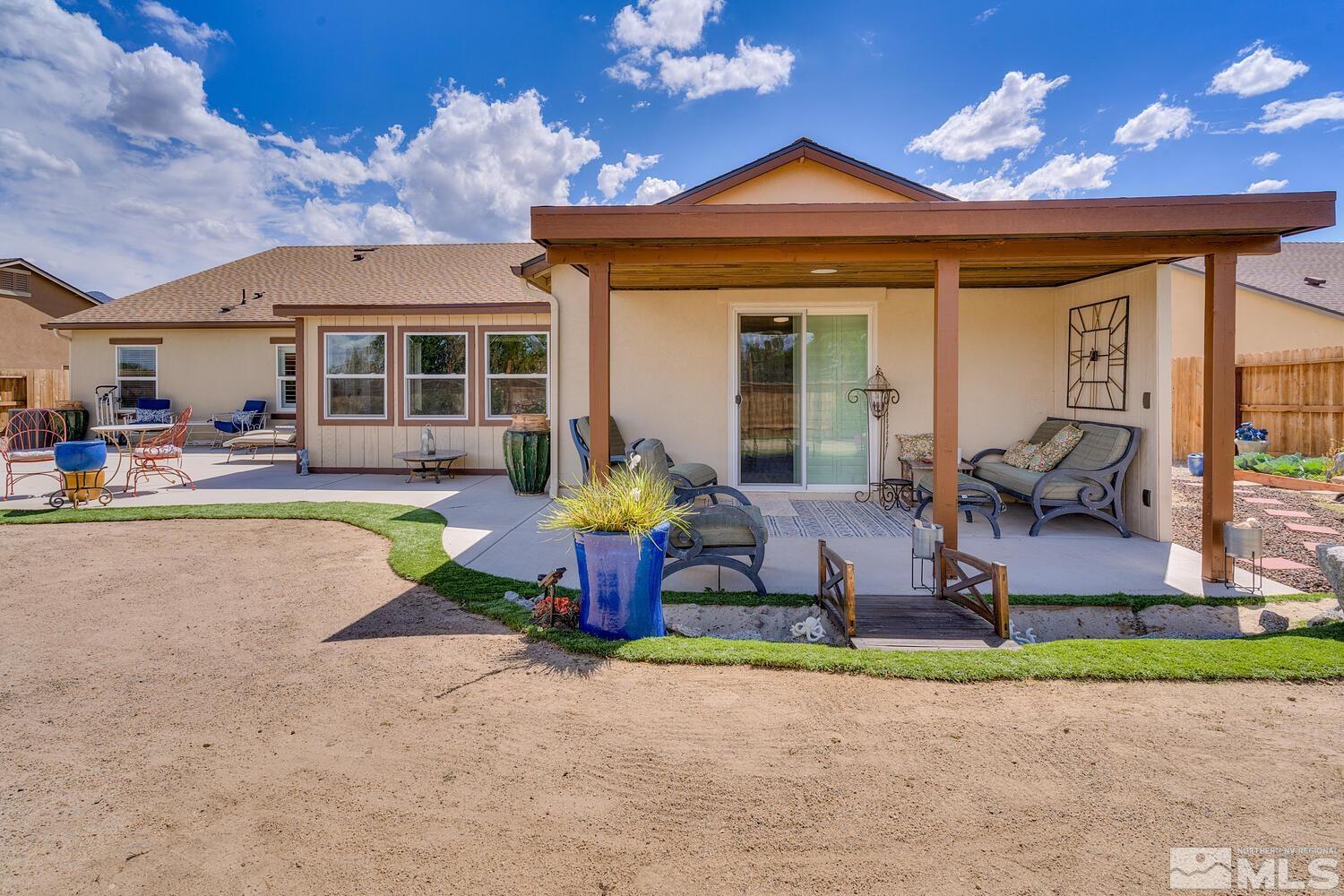 148 Carson River Drive Dayton, NV 89403 - Photo 18 of 31 a front view of a house with swimming pool and a yard