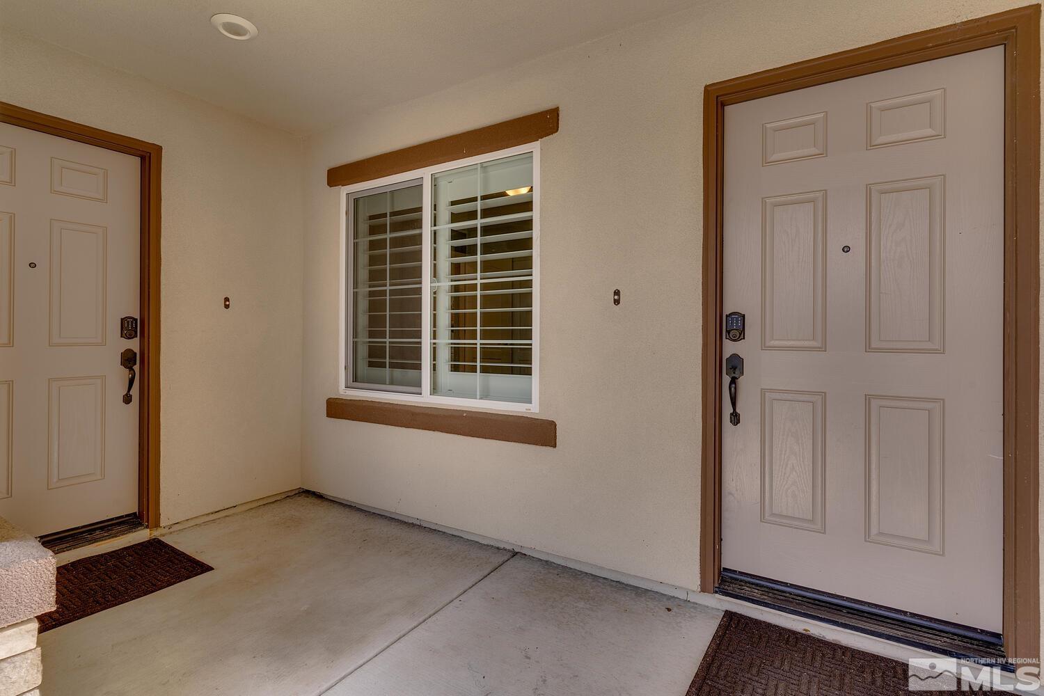 148 Carson River Drive Dayton, NV 89403 - Photo 2 of 31 an empty room with windows