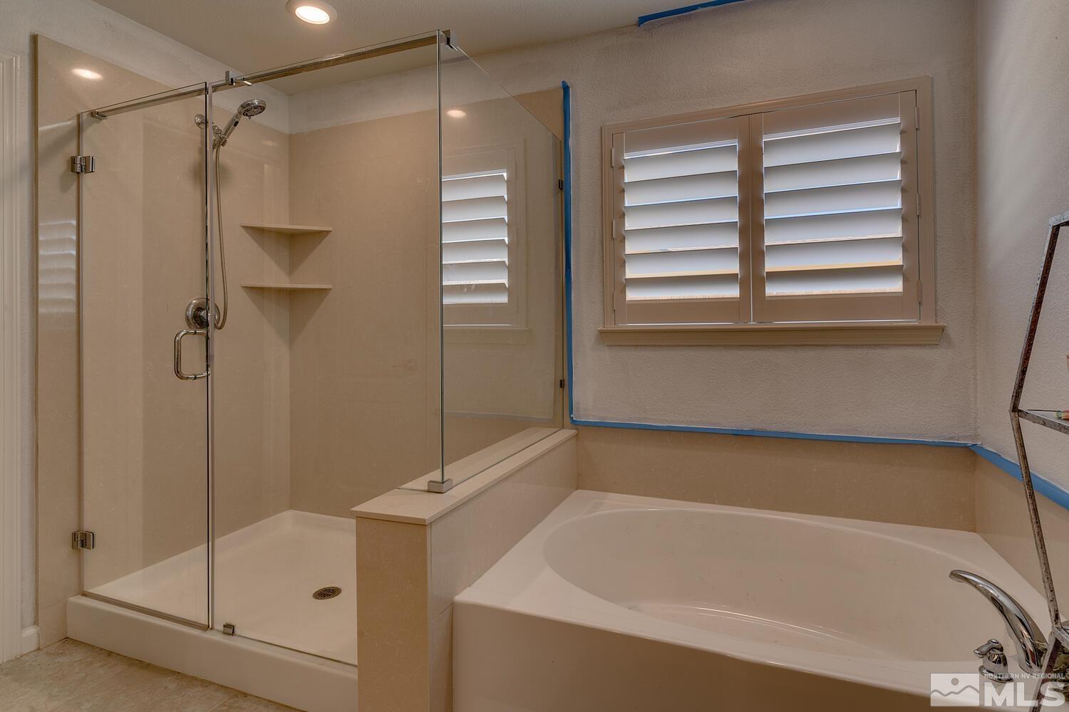 148 Carson River Drive Dayton, NV 89403 - Photo 22 of 31 a bathroom with a bath tub and a shower