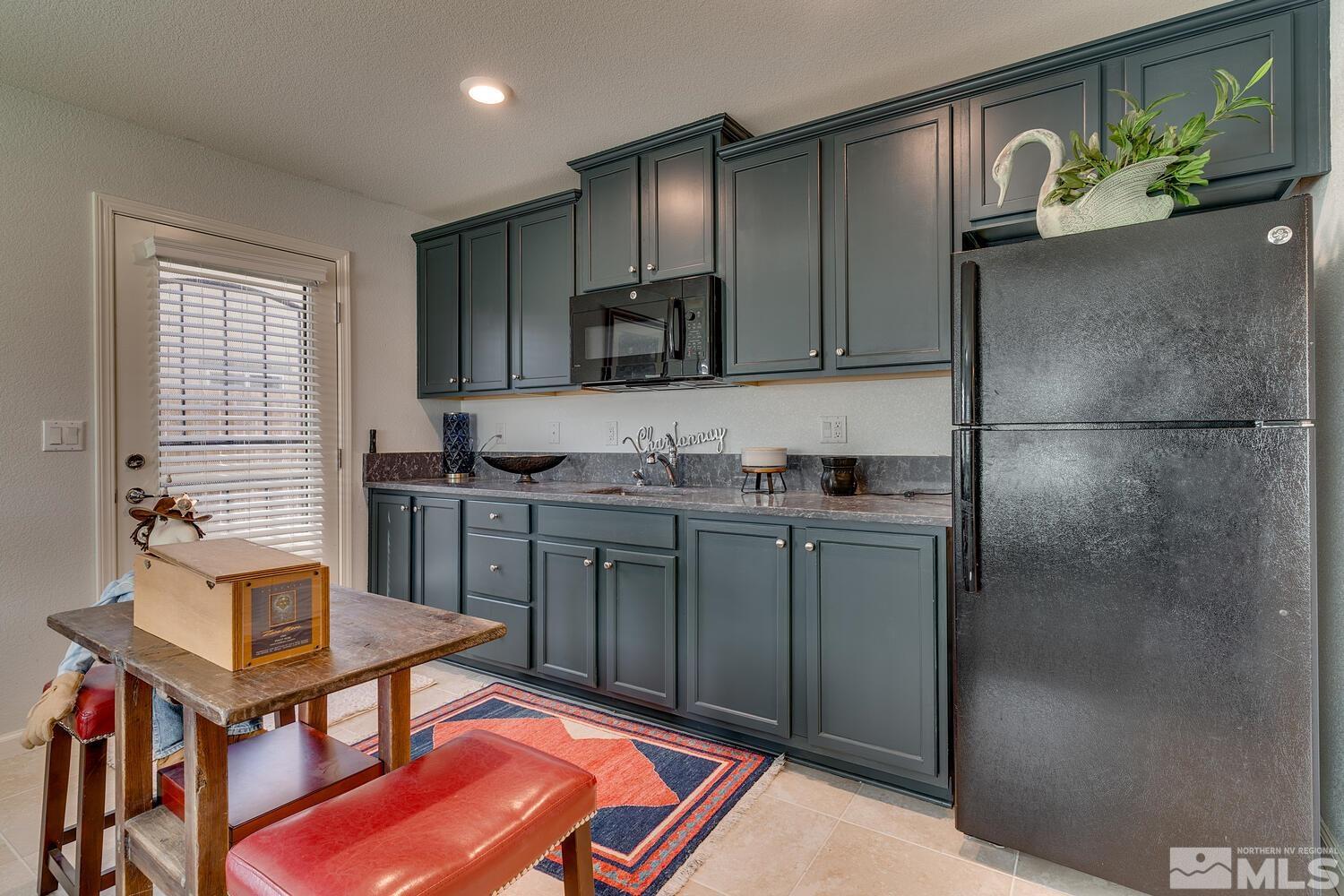 148 Carson River Drive Dayton, NV 89403 - Photo 28 of 31 a kitchen with stainless steel appliances granite countertop a refrigerator and a stove