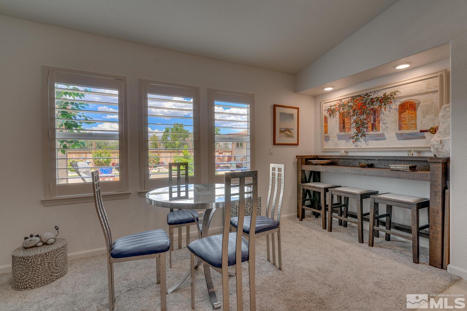 148 Carson River Drive Dayton, NV 89403 - Photo 10 of 31 a view of a dining room with furniture and chandelier