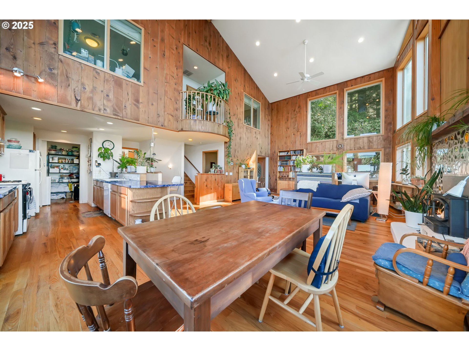 674 Pacific View Drive Yachats, OR 97498 - Photo 18 of 47 a dining room with furniture a rug and wooden floor