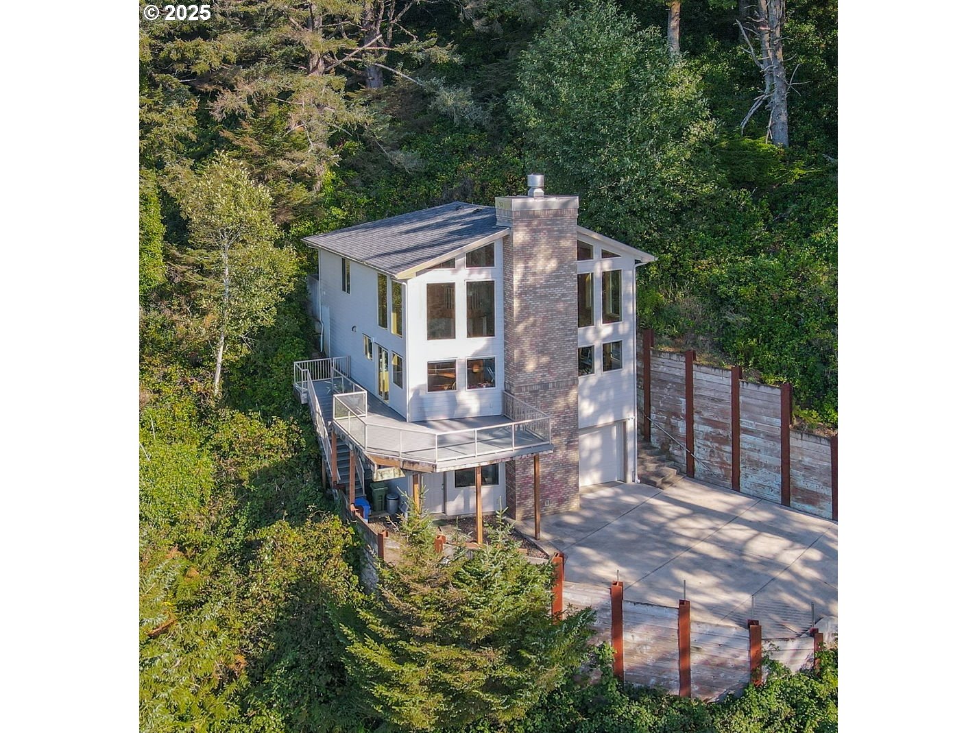 674 Pacific View Drive Yachats, OR 97498 - Photo 2 of 47 a view of a house with backyard and sitting area