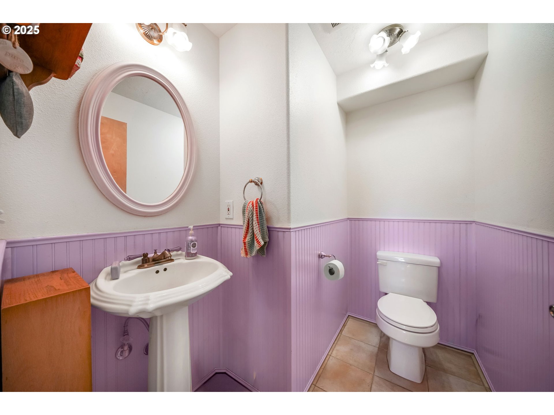 674 Pacific View Drive Yachats, OR 97498 - Photo 31 of 47 a bathroom with a toilet sink and mirror