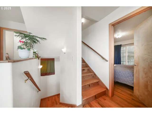 a living room with furniture and a kitchen