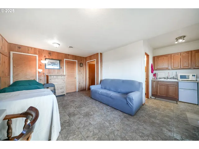a utility room with cabinets washer and dryer