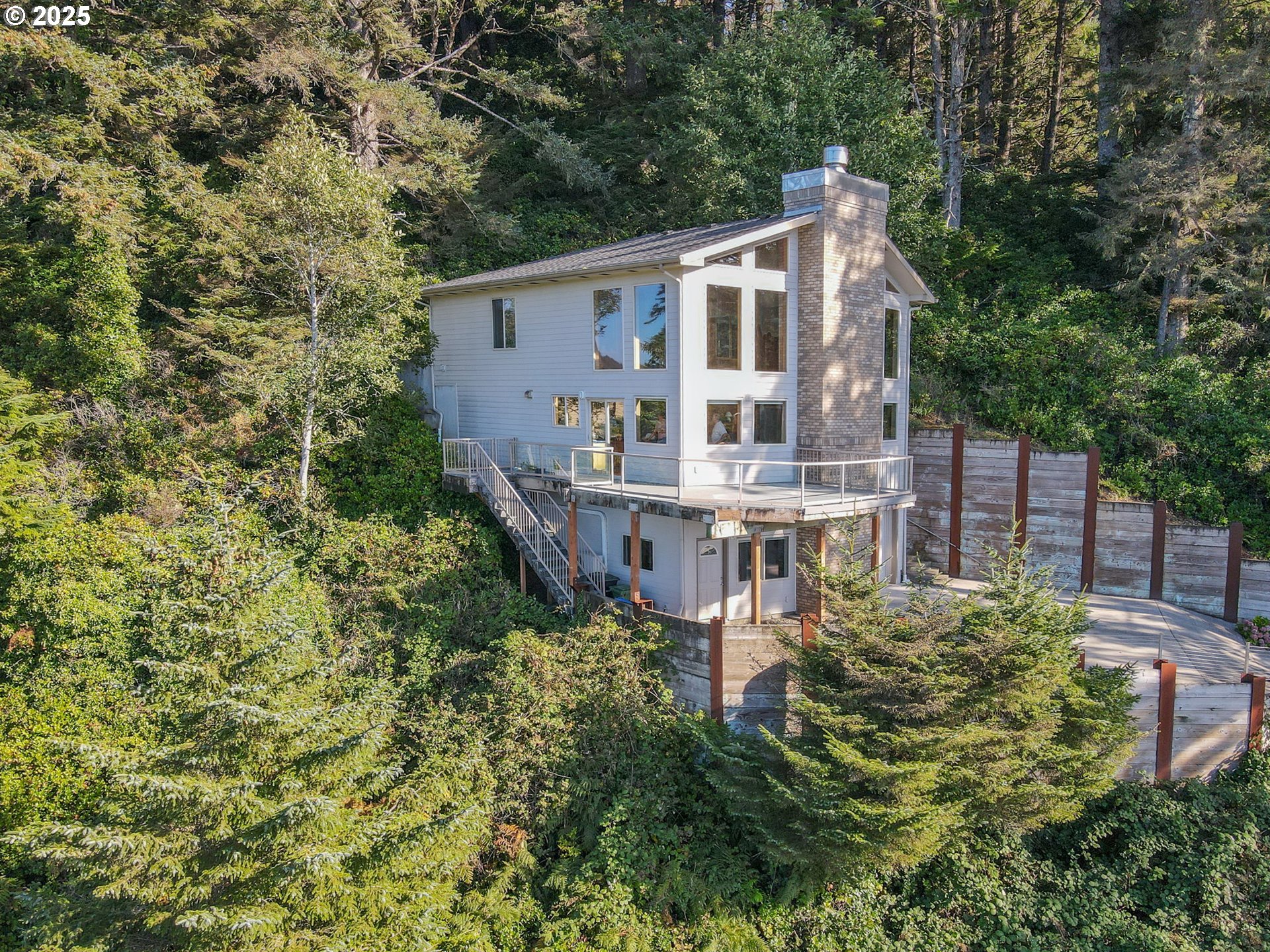 674 Pacific View Drive Yachats, OR 97498 - Photo 5 of 47 front view of a house with a small yard