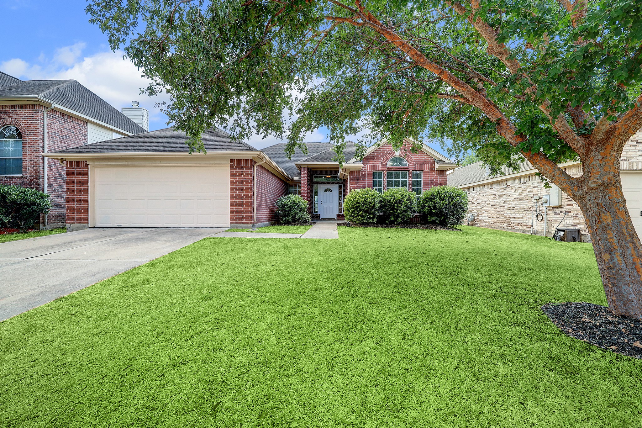 24031 Holleygate Court Spring, TX 77373 - Photo 1 of 17 a front view of house with yard and green space
