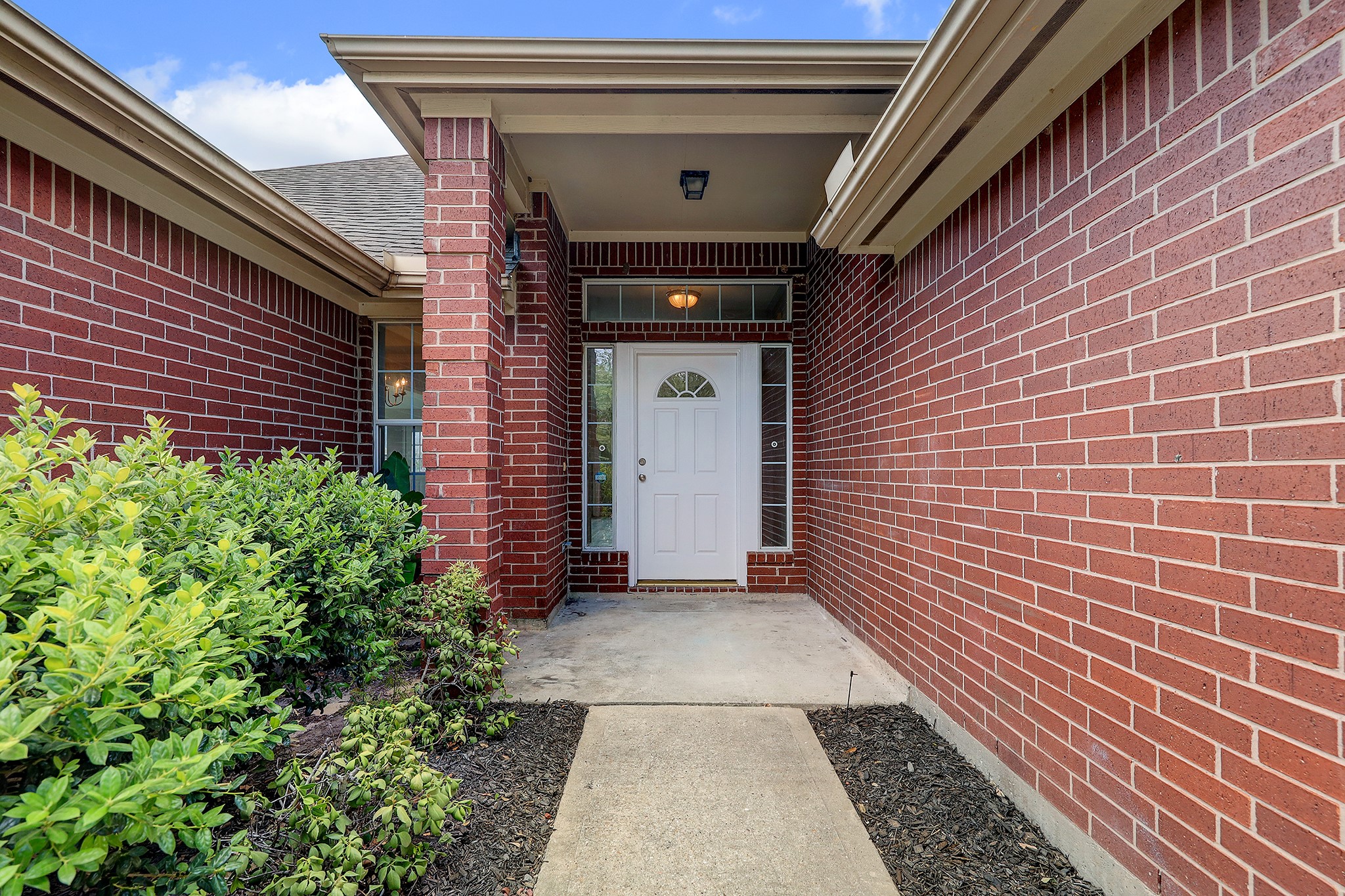 24031 Holleygate Court Spring, TX 77373 - Photo 2 of 17 a view of a pathway both side of house