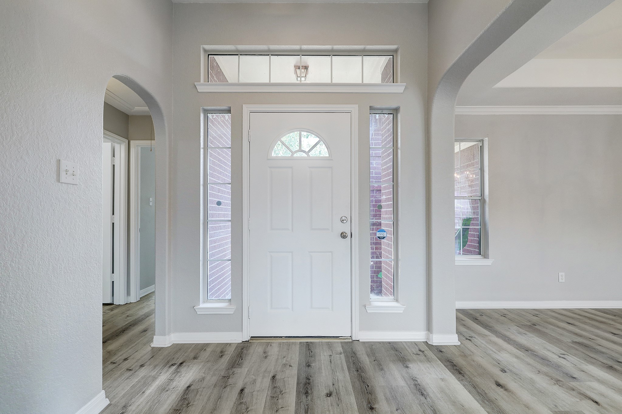 24031 Holleygate Court Spring, TX 77373 - Photo 3 of 17 a view of an empty room with wooden floor and a window