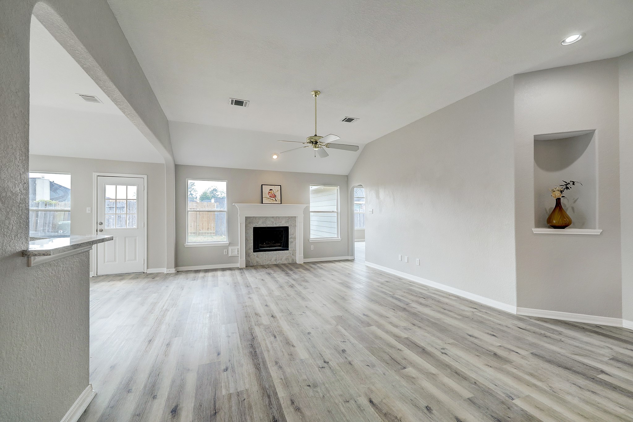 24031 Holleygate Court Spring, TX 77373 - Photo 5 of 17 an empty room with wooden floor and windows