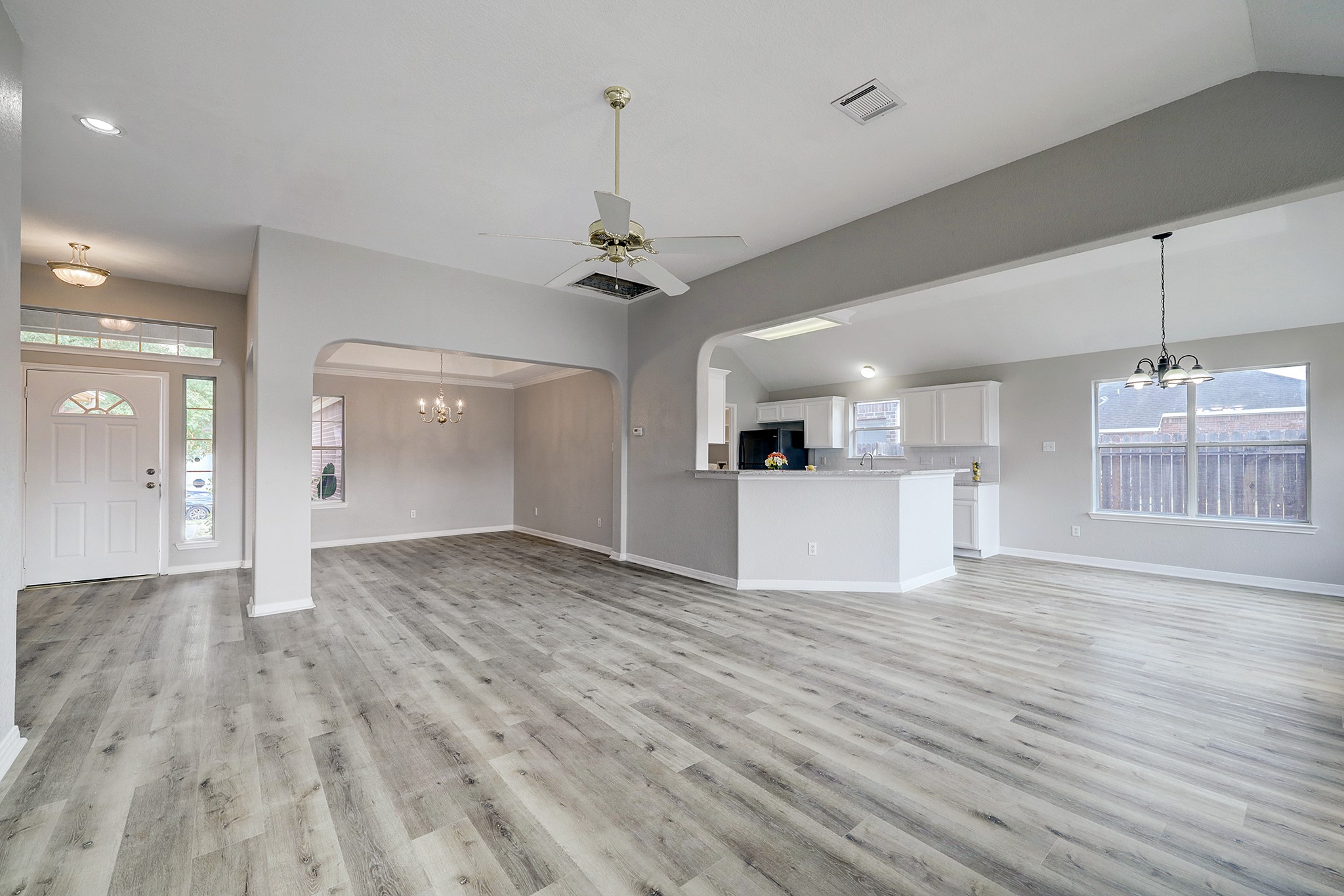 24031 Holleygate Court Spring, TX 77373 - Photo 6 of 17 a view of a kitchen with wooden floor and a sink