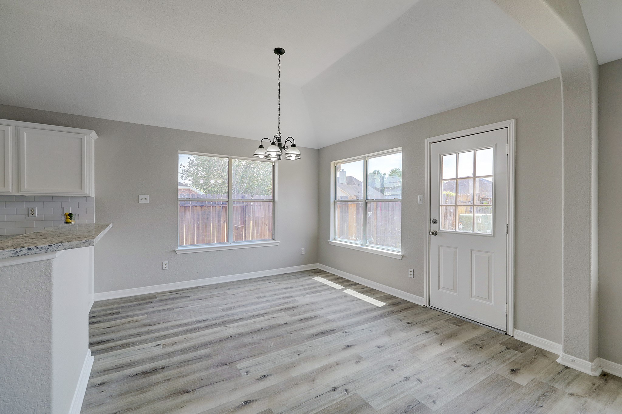 24031 Holleygate Court Spring, TX 77373 - Photo 7 of 17 a view of an empty room with a window and wooden floor