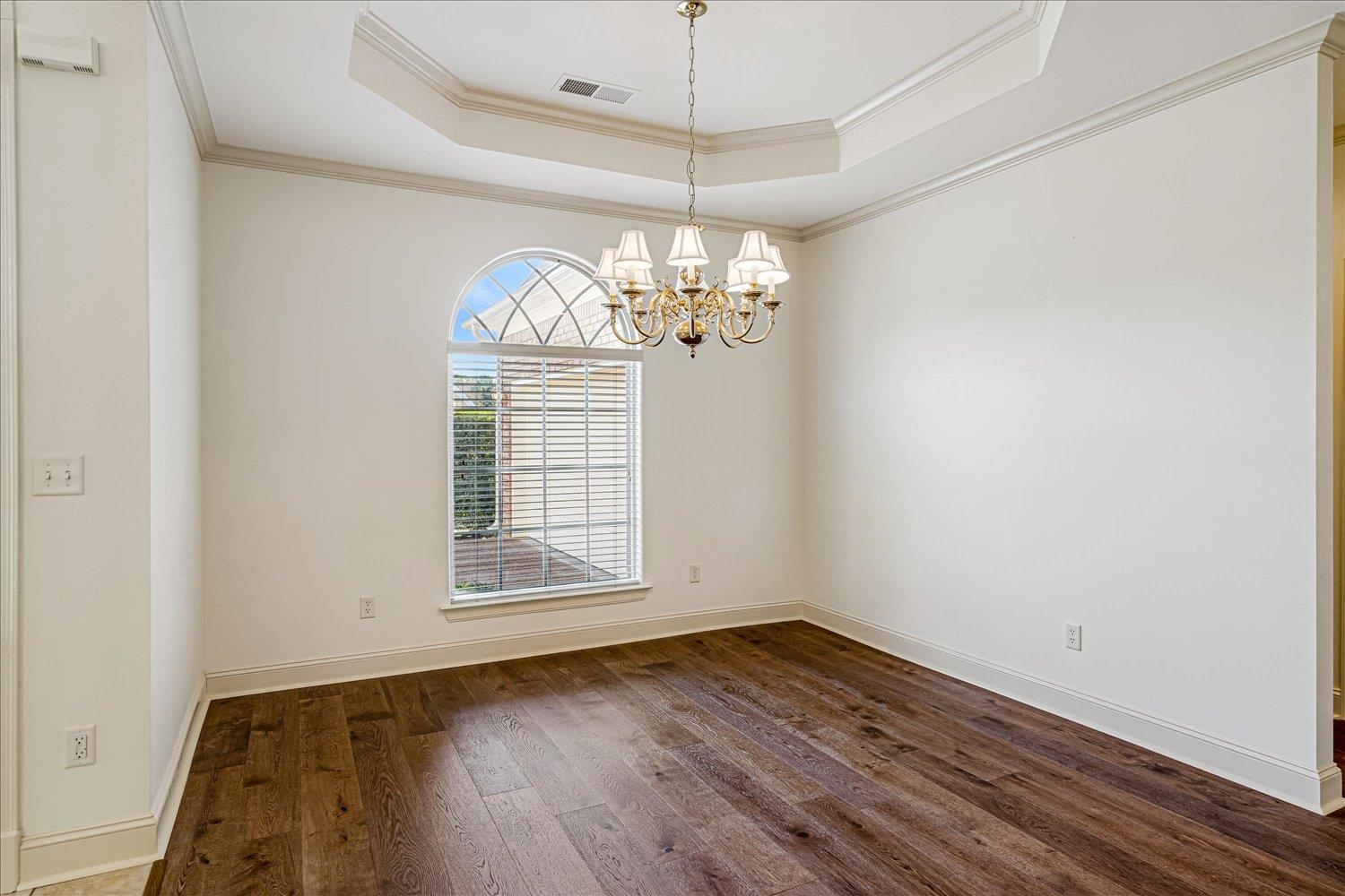 9178 Wilderridge Lane Memphis, TN 38018 - Photo 11 of 31 a view of a room with wooden floor and chandelier