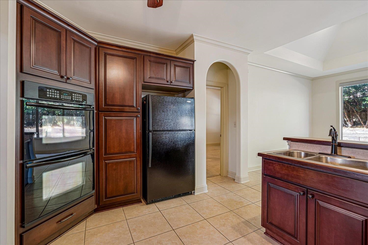 9178 Wilderridge Lane Memphis, TN 38018 - Photo 18 of 31 a kitchen with stainless steel appliances granite countertop a refrigerator and a sink