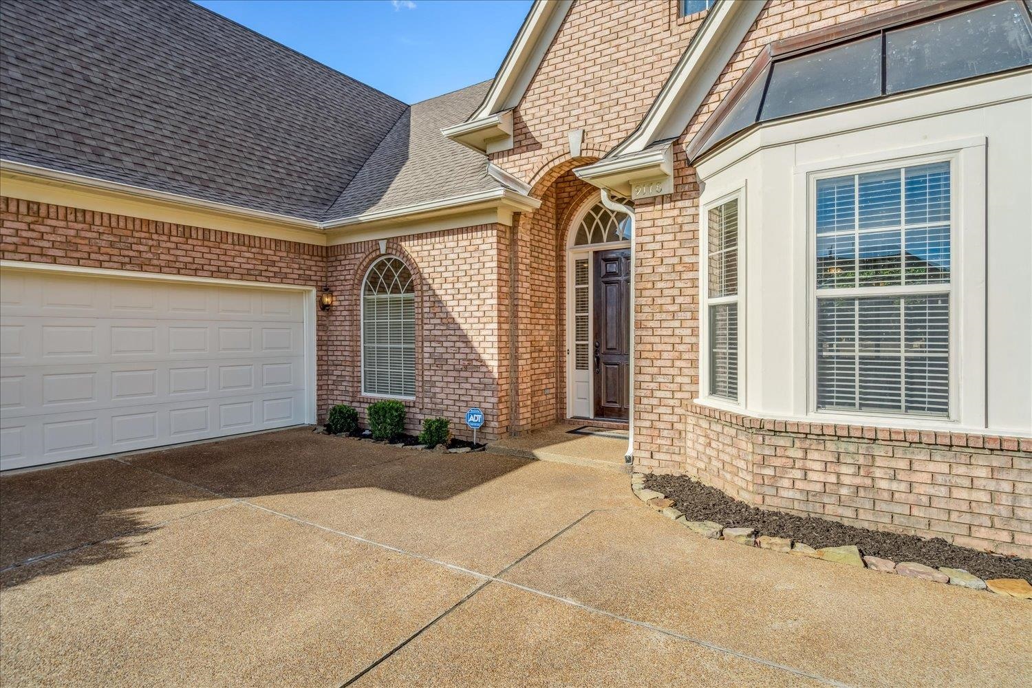 9178 Wilderridge Lane Memphis, TN 38018 - Photo 3 of 31 a view of a house with a backyard