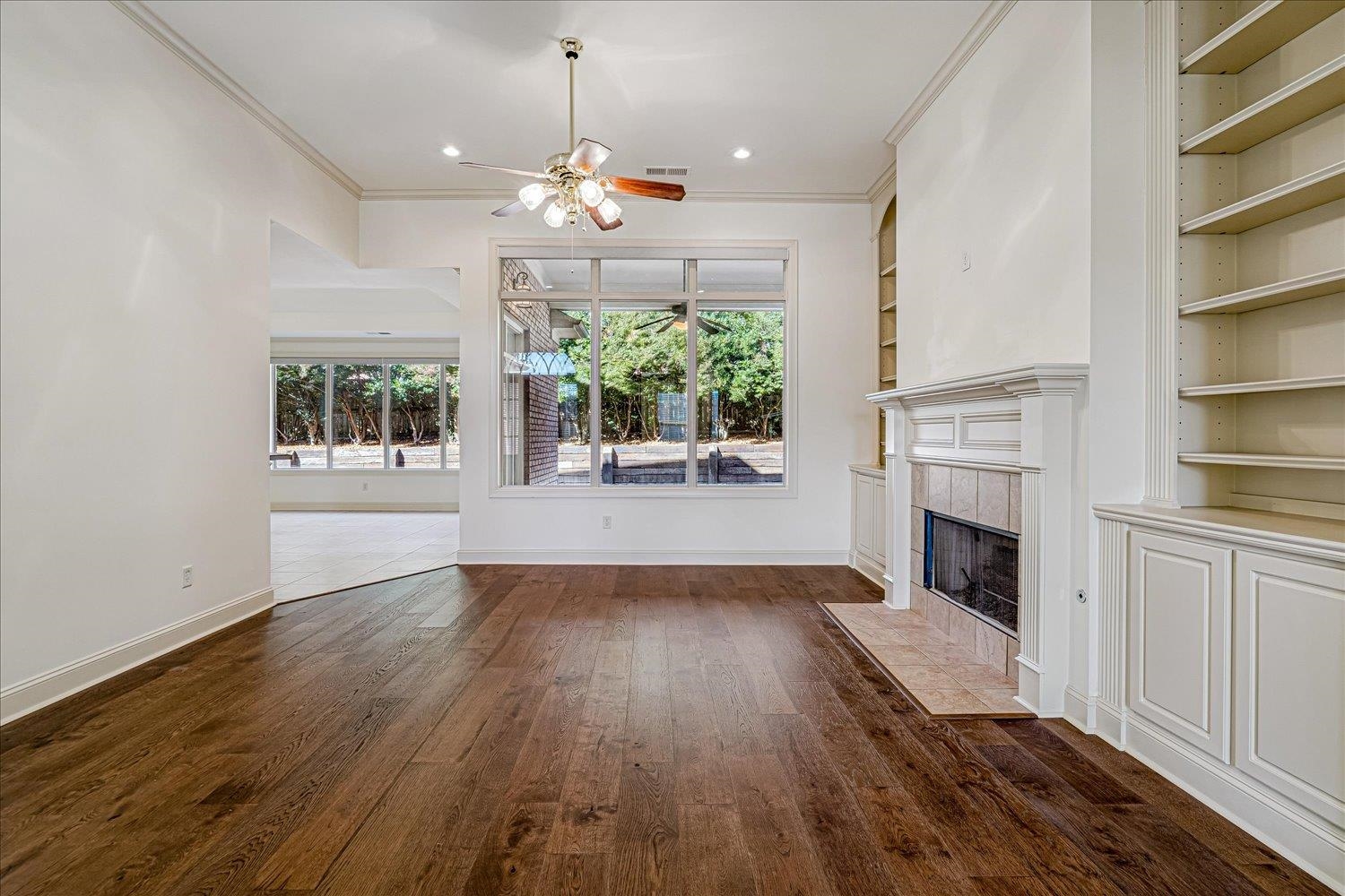 9178 Wilderridge Lane Memphis, TN 38018 - Photo 7 of 31 a view of a room with wooden floors and fireplace