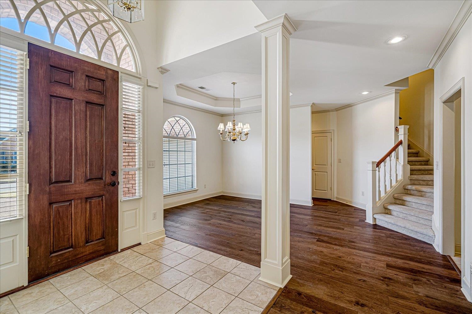 9178 Wilderridge Lane Memphis, TN 38018 - Photo 10 of 31 a view of a hallway with wooden floor and staircase