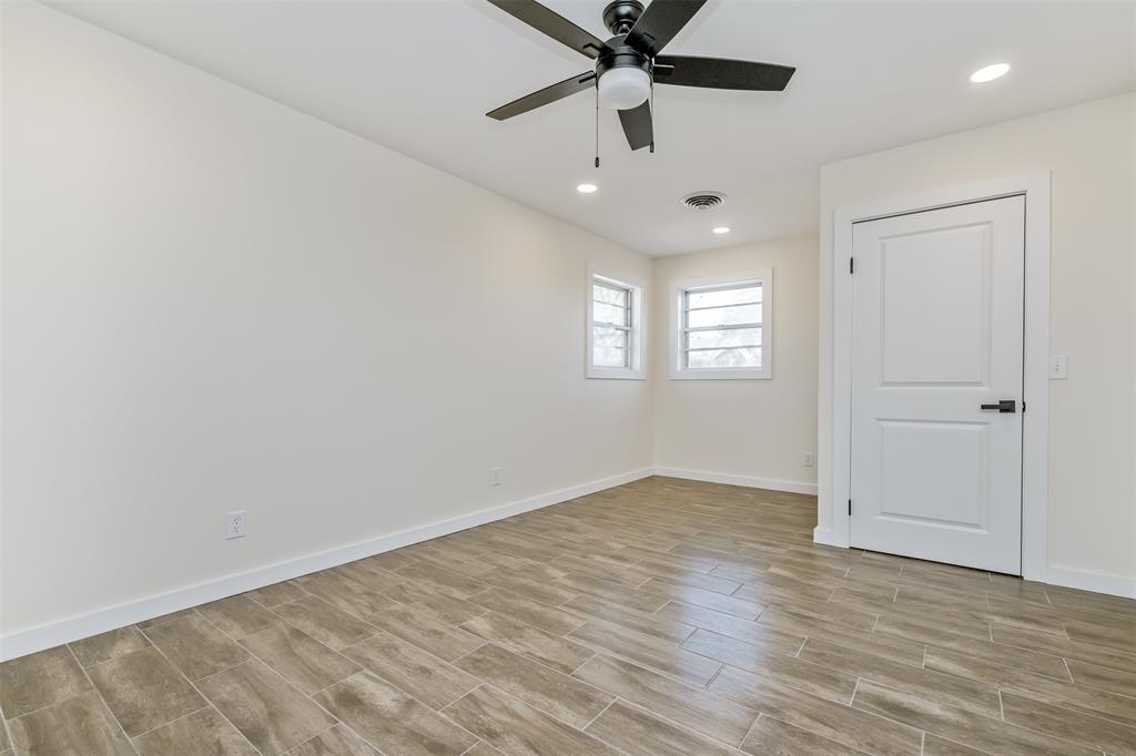 2006 Borger Plainview, TX 79072 - Photo 17 of 27 an empty room with windows and fan view