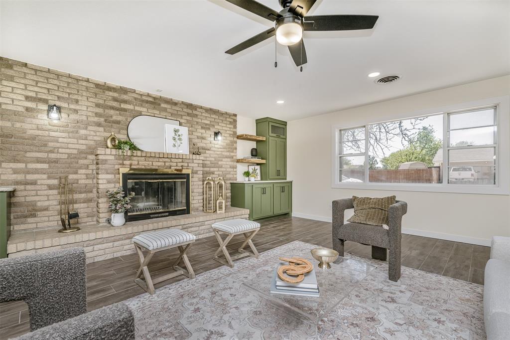 2006 Borger Plainview, TX 79072 - Photo 2 of 27 a living room with furniture and a fireplace