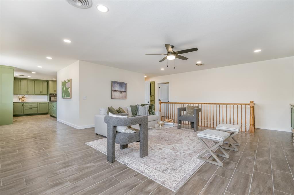 2006 Borger Plainview, TX 79072 - Photo 3 of 27 a view of a livingroom with furniture and a ceiling fan