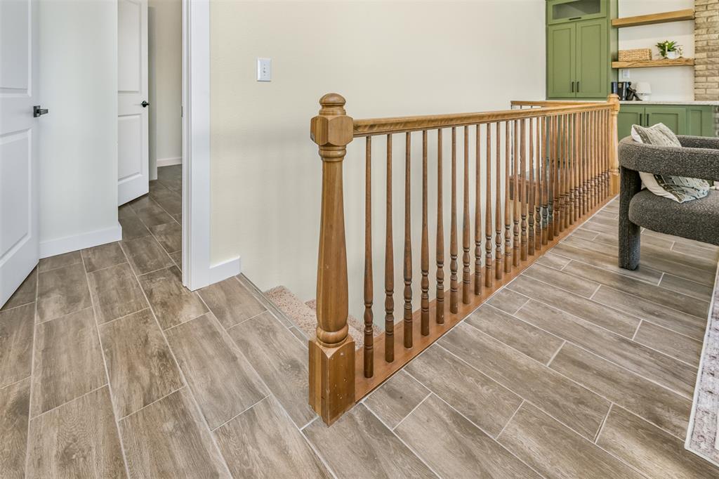 2006 Borger Plainview, TX 79072 - Photo 4 of 27 a view of a hallway with wooden floor and a floor to ceiling window