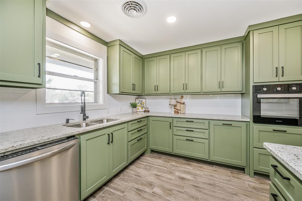 2006 Borger Plainview, TX 79072 - Photo 9 of 27 a kitchen with sink a window and appliances