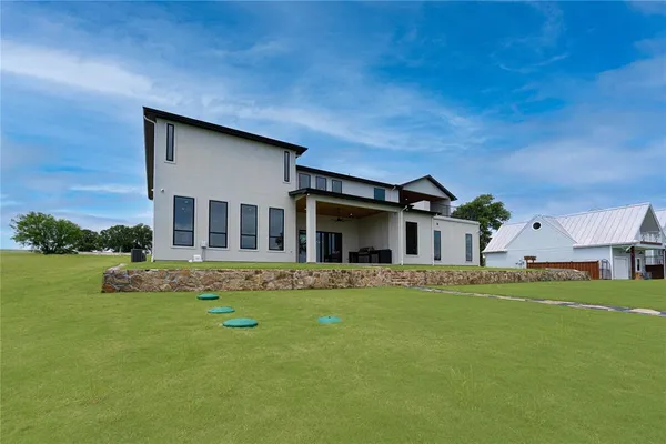 a house that is sitting in the grass