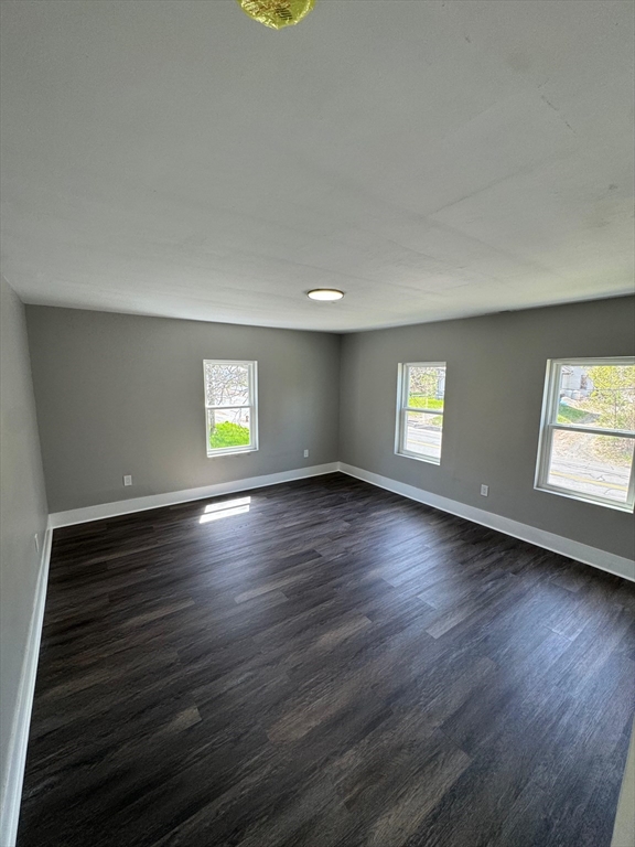 32 Main Street Monson, MA 01057 - Photo 34 of 42 an empty room with wooden floor and windows