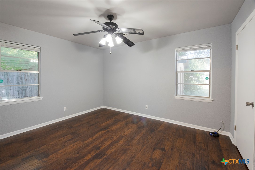 1201 Ridgemont Drive Killeen, TX 76549 - Photo 12 of 21 a view of a big room with wooden floor and windows