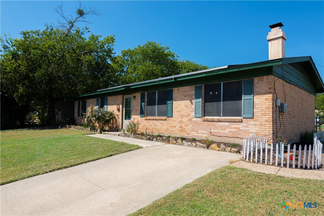 1201 Ridgemont Drive Killeen, TX 76549 - Photo 3 of 21 a front view of a house with a yard