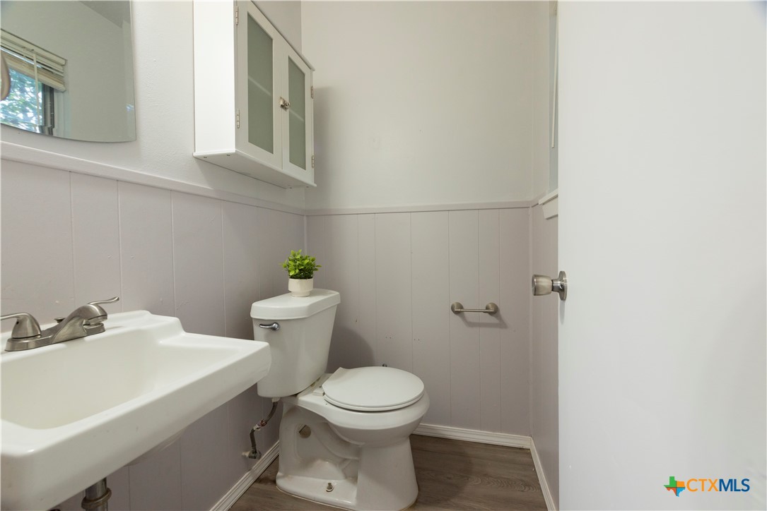 1201 Ridgemont Drive Killeen, TX 76549 - Photo 10 of 21 a white toilet sitting next to a bathroom sink