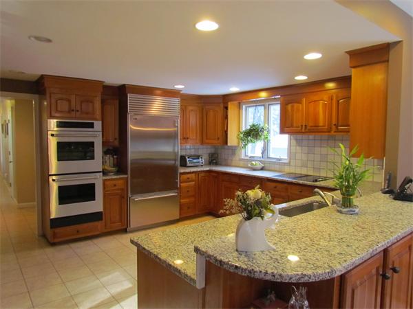 233 Country Way Needham, MA 02492 - Photo 5 of 18 a kitchen with sink refrigerator and microwave