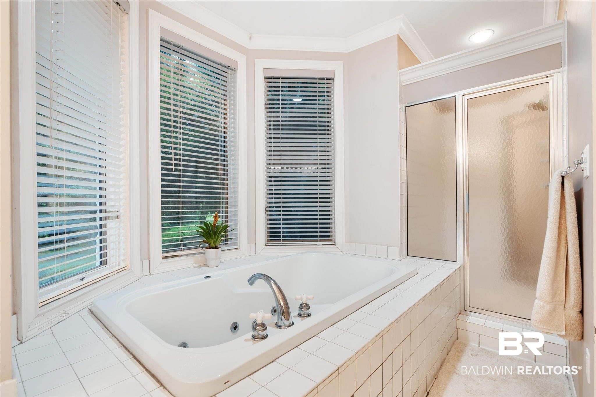 6458 Raintree Road Fairhope, AL 36532 - Photo 21 of 65 Bathroom with tile patterned floors, plus walk in shower, and ornamental molding