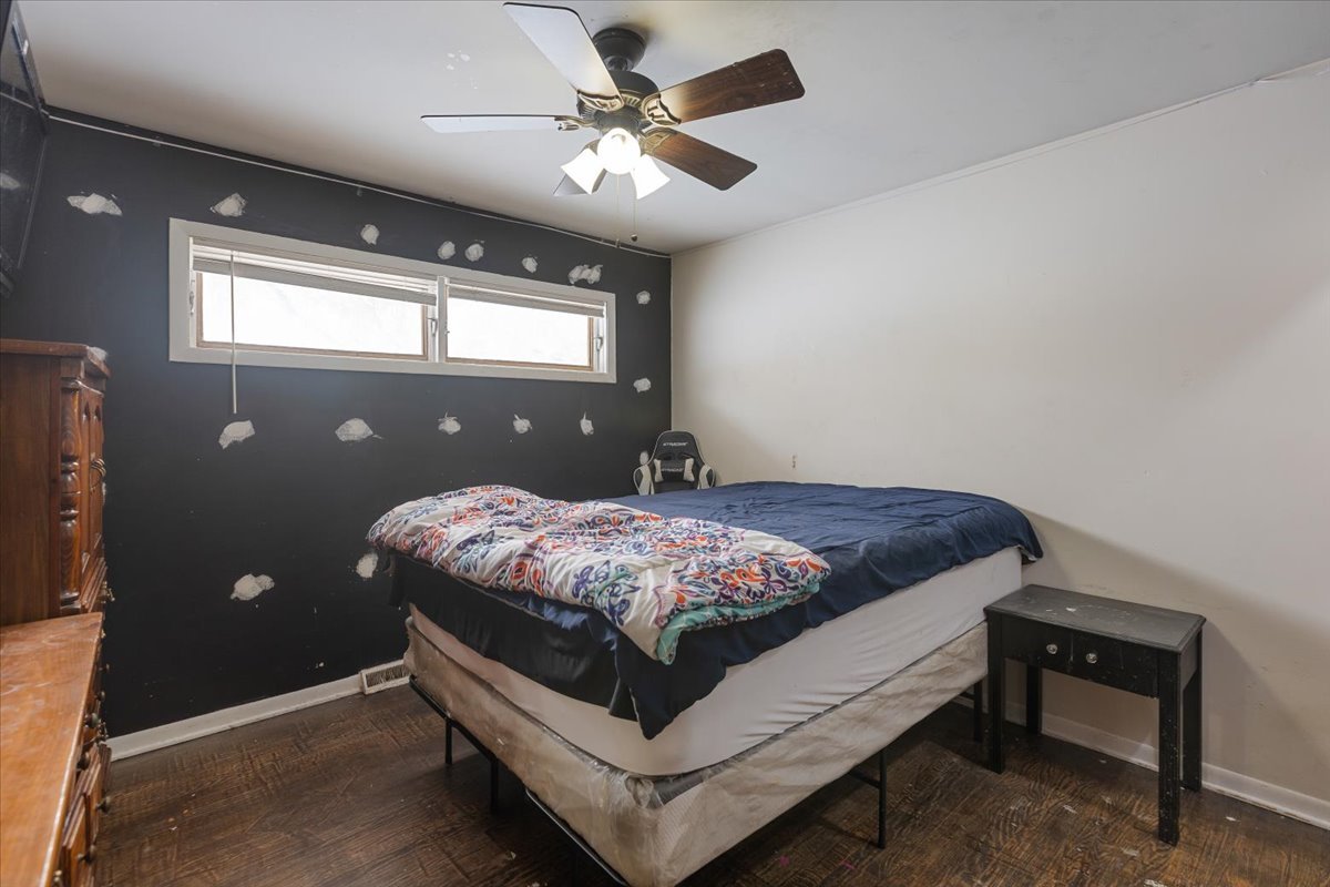 1246 Thomas Street Homewood, IL 60430 - Photo 16 of 29 a bed sitting in a bedroom next to a window